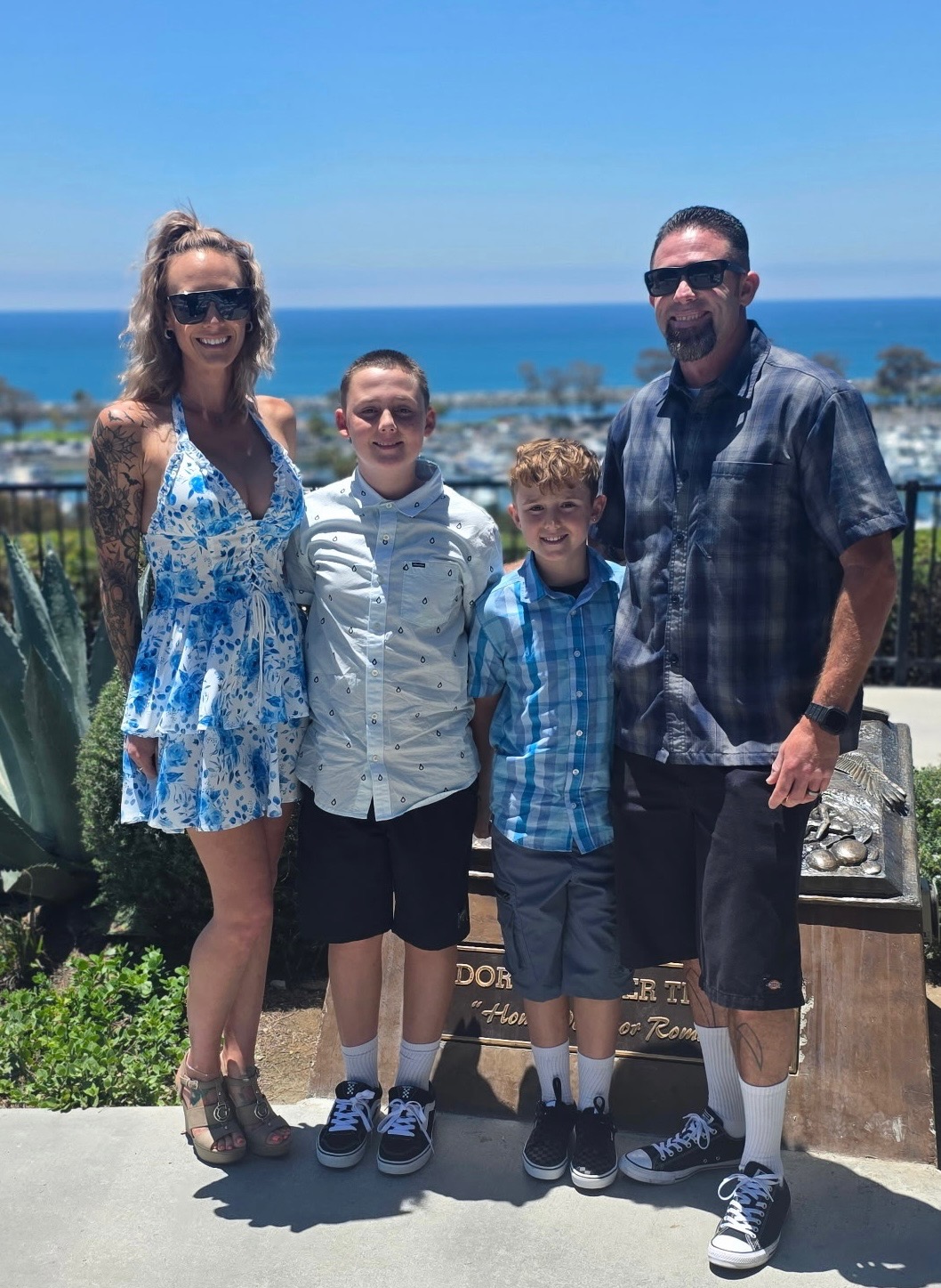 Corey and Camber Czuczka with family — owners of Impact Painting